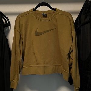 Medium: Green Nike crop sweater. Small stain on the front.